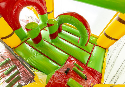 Overdekt opblaasbaar multiplay springkasteel met glijbaan kopen in jungle thema voor kids. Bestel opblaasbare springkastelen online bij JB Inflatables Nederland