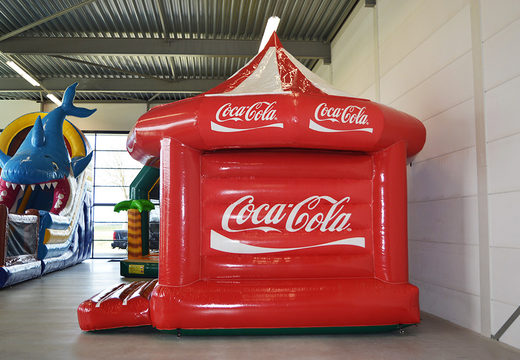Bestel nu op maat gemaakte Coca-cola Carrousel springkastelen bij JB Promotions Nederland. Maatwerk opblaasbare reclame springkastelen  in verschillende soorten en maten te koop
