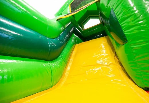 Bestel een multifunctioneel springkasteel in thema jungle met een glijbaan voor kids. Koop springkastelen online bij JB Inflatables Nederland
