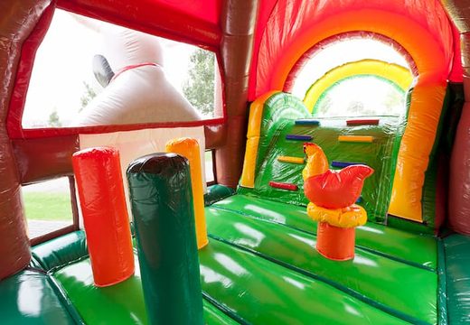 Groot opblaasbaar overdekt multiplay super springkussen met glijbaan kopen in thema boerderij farm voor kinderen