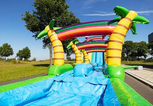 Bestel Drop & Slide Jungle springkasteel met dubbele glijbaan voor kinderen. Koop opblaasbare springkastelen online bij JB Inflatables Nederland