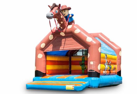 Groot overdekt springkasteel kopen in thema cowboy western voor kinderen. Bestel springkastelen online bij JB Inflatables Nederland