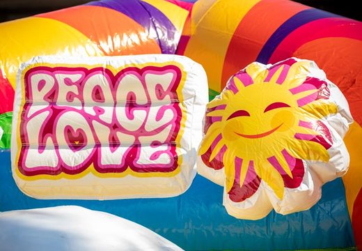 Inflatable multiplay super springkasteel in hippie thema met veel kleuren bestellen voor kinderen